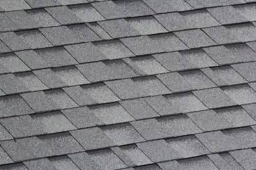 Close-up of grey architectural asphalt shingles