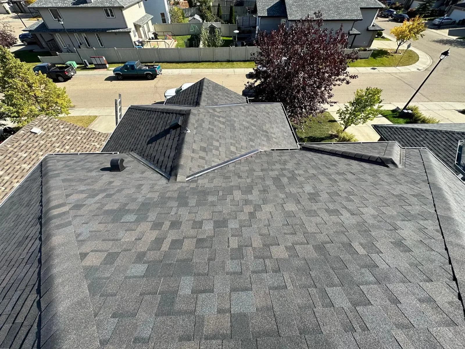 New hip roof with grey architectural shingles