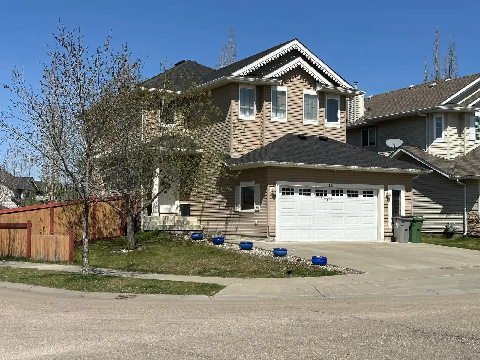 Two-storey home with a newly replaced shingle roof